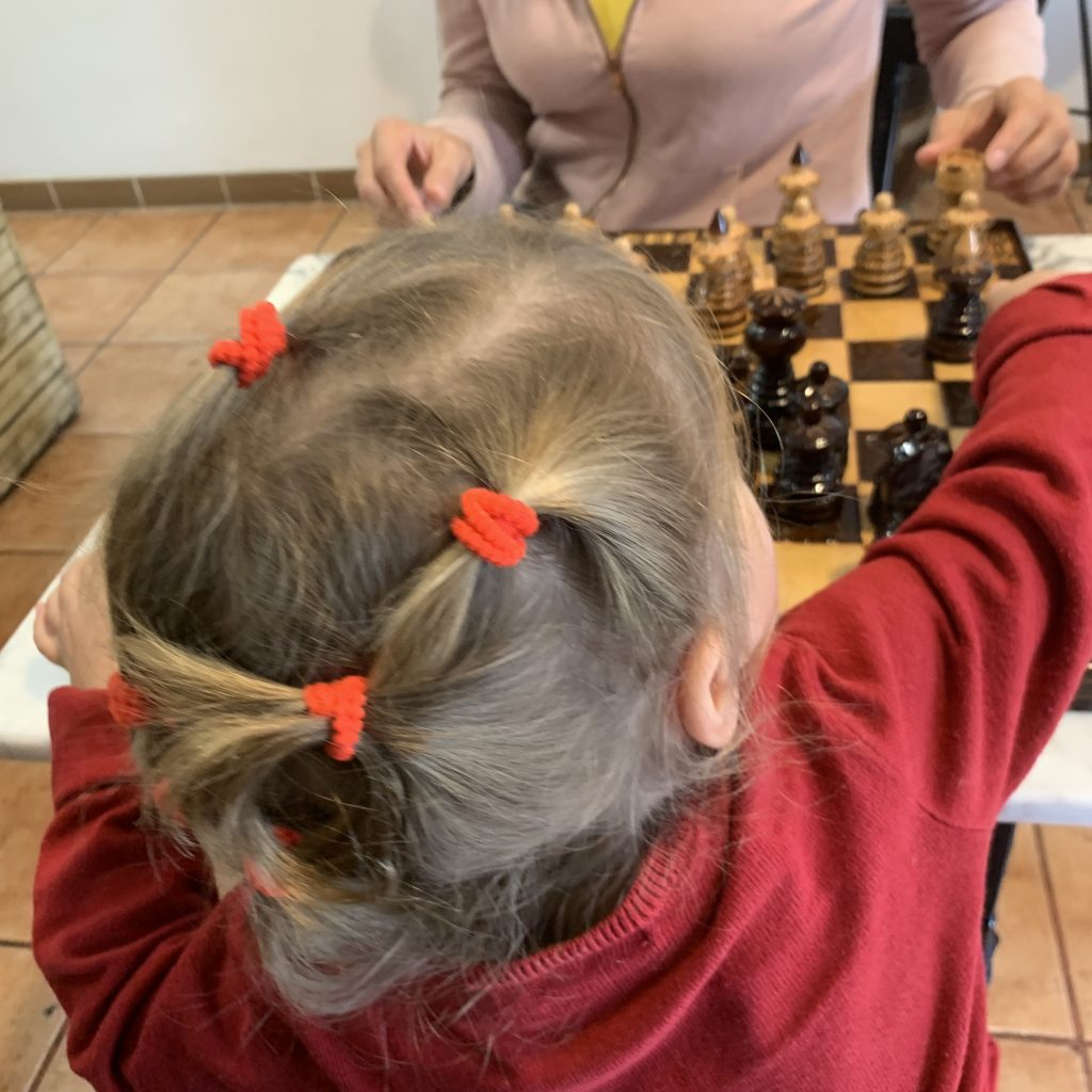 Child plays chess