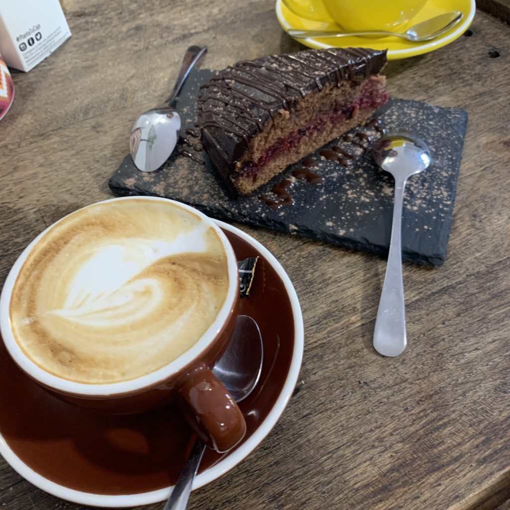 delicious cake with a cup of cappuccino