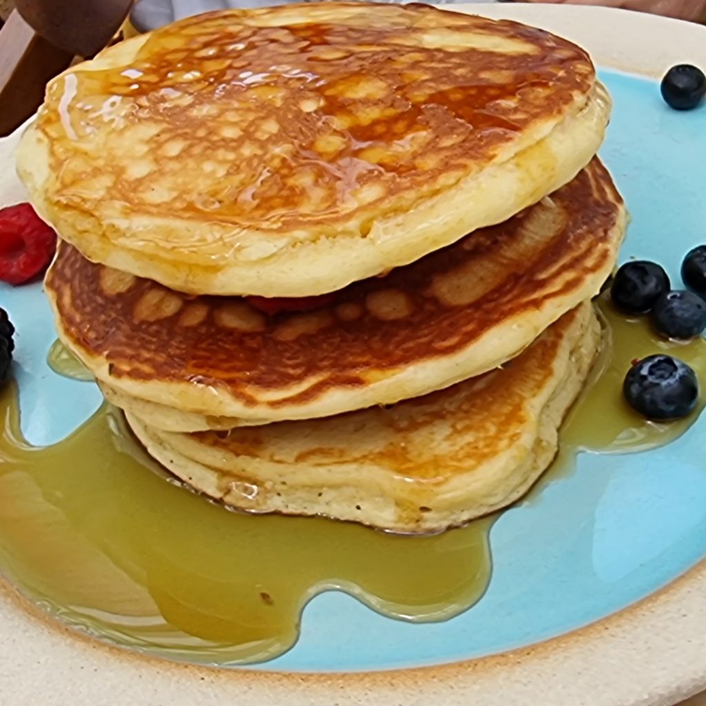 Pancake with Fresh Fruit and maple Syrup at Dubai top brunch & cake resturant