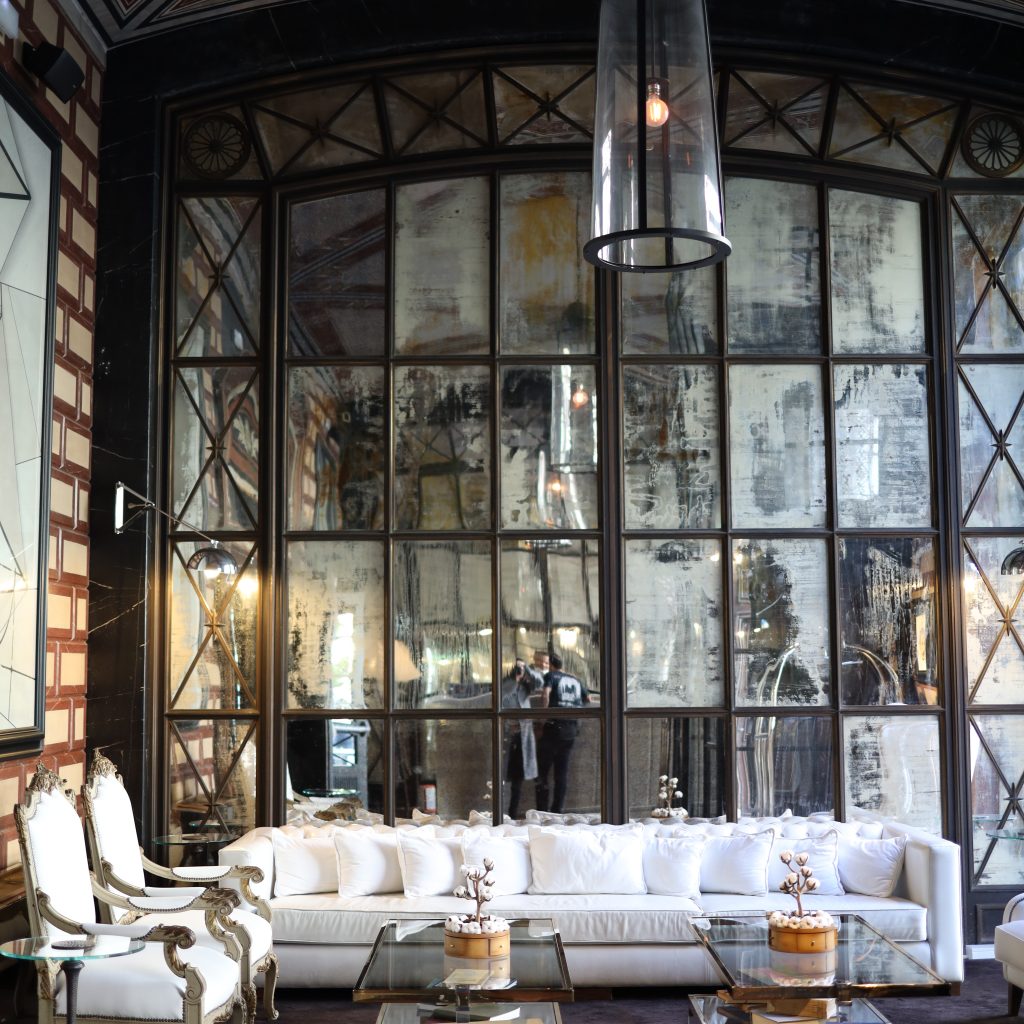 Barcelona's Cotton House Hotel: An inviting entrance with a warm and luxurious ambiance.