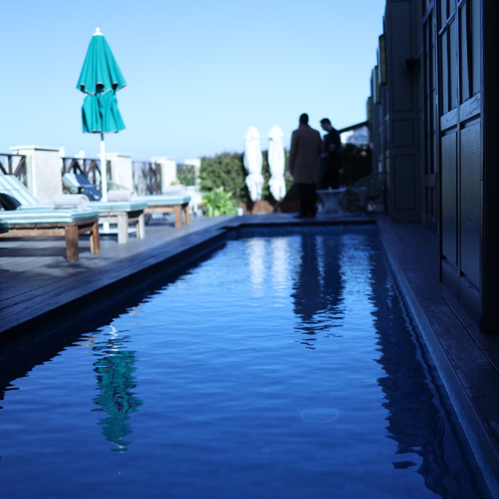 Serene Poolside Escape: The Cotton House Barcelona swimming pool offers a tranquil oasis for relaxation.