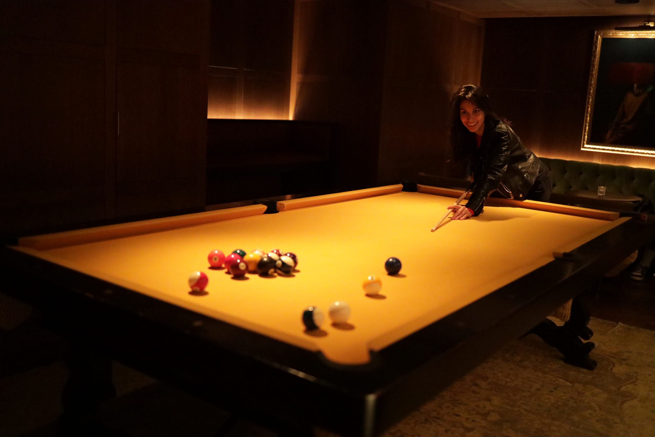 Oksa enjoying pool game in the Punch Room Bar at Edition hotel Barcelona